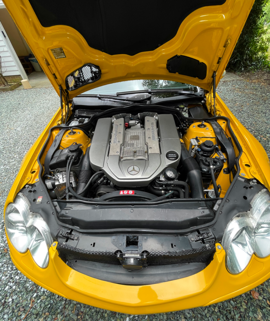 Picture of yellow SL55 engine bay after cleaning